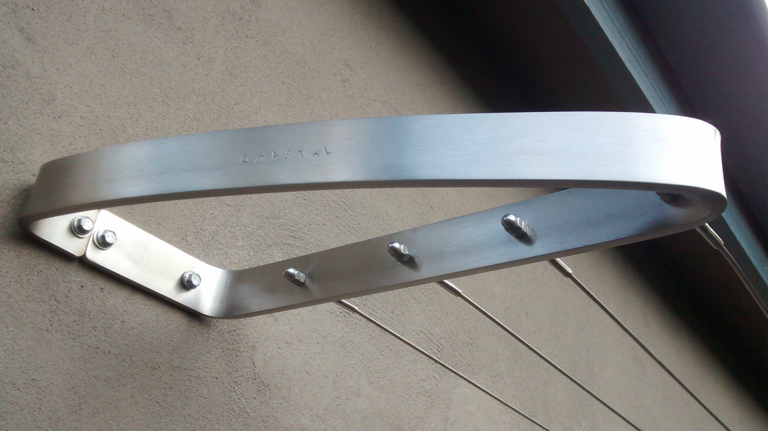 Wall mounted clothes line brick timber and steel Coastal Clotheslines